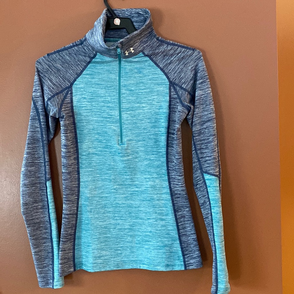 Under Armour cold gear, ladies three-quarter zip running shirt in size small.